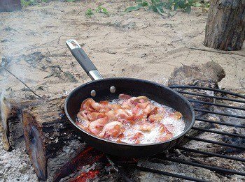 cooking bacon on campfire