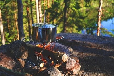 stainles steel pot on campfire
